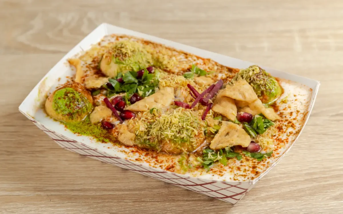Bhalla Papdi Chaat topped with yogurt and dhaniya coriander on Indian street food chaat in Brampton